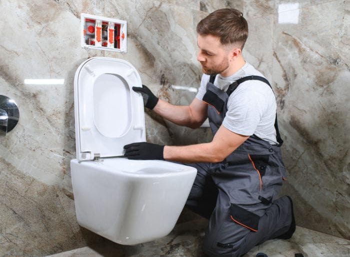 professional-plumber-working-with-toilet-bowl-in-b-2024-04-23-02-26-45-utc-qovajn0g8jy8sltkdsyj6taf03jxjr92qgzj5uecym-min Toilet Repair and Installation Photo